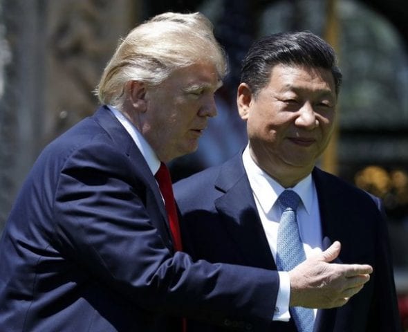 By exiting the Paris climate deal, President Donald Trump is handing over global leadership to Chinese President Xi Jinping, seen here with Trump at Mar-a-Lago in January. CREDIT: AP/Alex Brandon, File