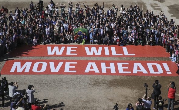 Participants at the COP22 climate conference stage a public show of support for climate negotiations and Paris agreement, on the last day of the conference, in Marrakech, Morocco, Friday, Nov. 18, 2016. (AP Photo/David Keyton)