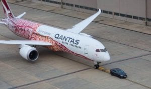 Tesla Model X electric vehicle tows Qantas Dreamliner jet