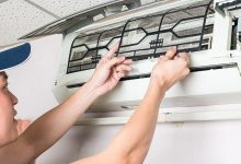 Young man Cleaning and washing maintenance dirty filter - optimised air conditioners