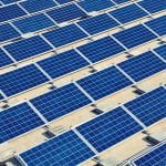 growth Solar panel energy plant on flat roof under construction - optimised