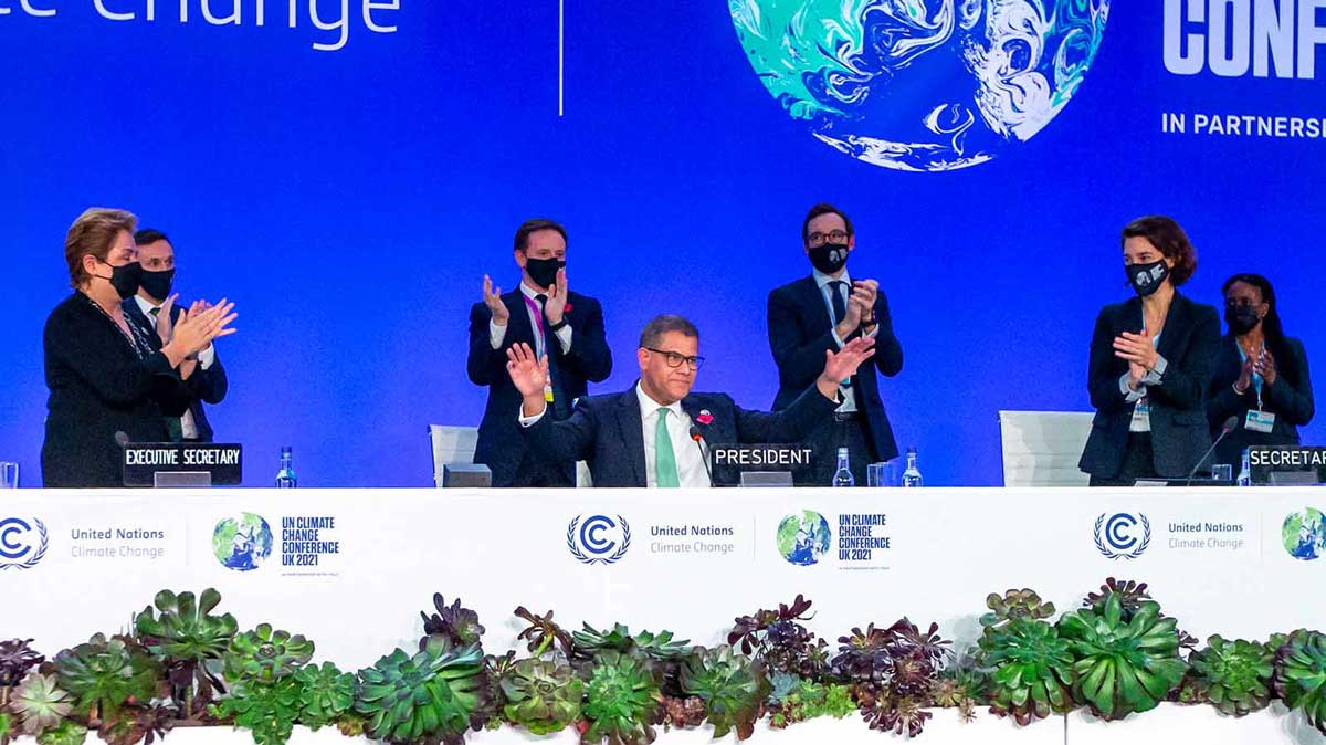 Alok Sharma, President of COP26, receives a standing ovation during the Plenary session of the COP26. Credit: EPA/Robert Perry.