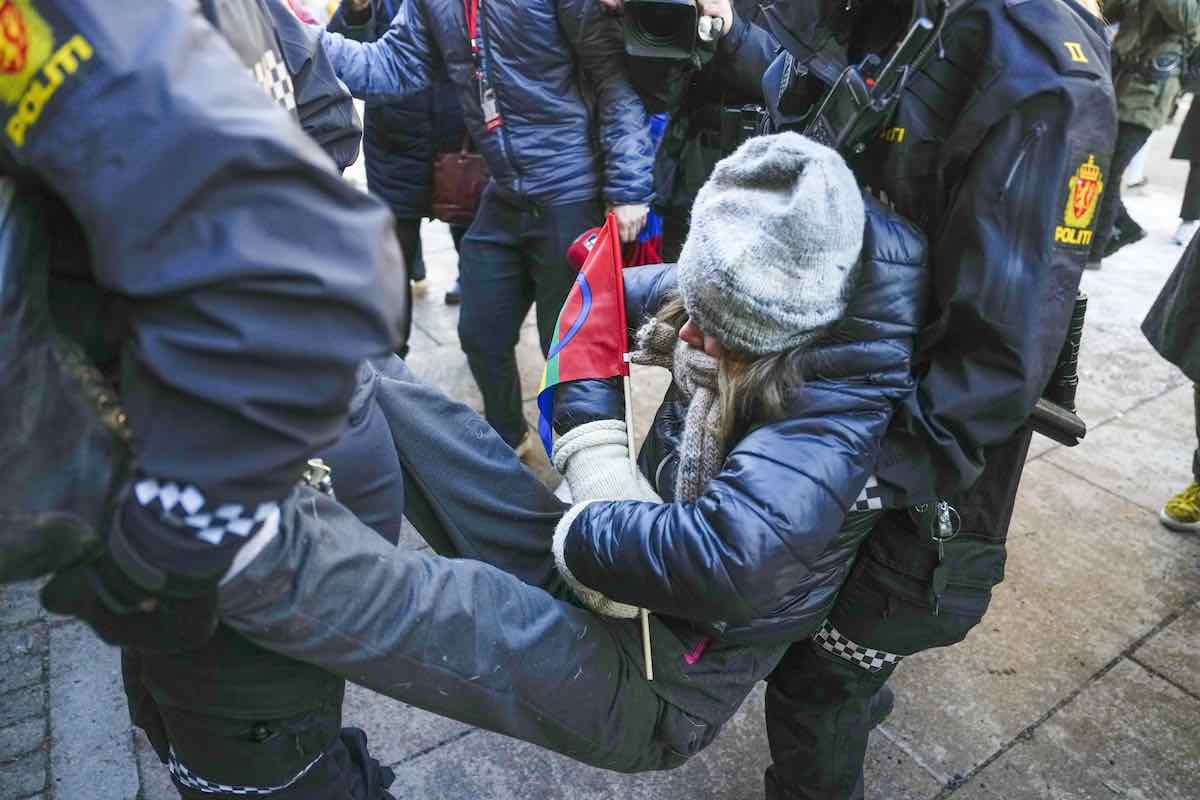 epa10496456 Police remove Swedish environmental activist Greta Thunberg (C) and other campaigners as they demonstrate outside the norway's Ministry of Finance entrance and several other ministries in a protest against still operating wind turbines at Fosen, in Oslo, Norway, 01 March 2023. Norway's Supreme Court has ruled in 2021 the wind turbines at Fosen are illegal. EPA/JAVAD PARSA NORWAY OUT