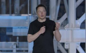 Musk says electric world that kicks out fossil fuels will cost less than combustion economy